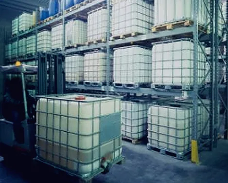 Forklift handling sacked cargo inside a warehouse